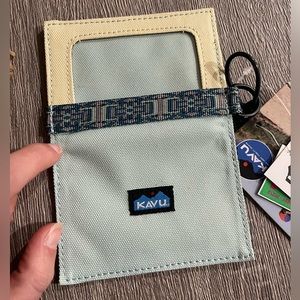 Brand New, unused light blue Kavu wallet.